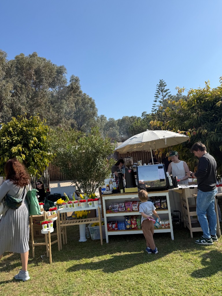 The Goose Coffee cart with flowers and pastries